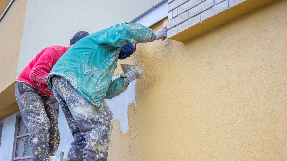 Stucco application on building exterior